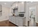 Well-appointed kitchen with granite counters, gas range, and stainless steel vent hood at 3374 Grey St, Duluth, GA 30096