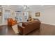 Inviting living room with hardwood floors, a ceiling fan, and access to a charming outdoor area at 3374 Grey St, Duluth, GA 30096