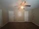 Bedroom with ceiling fan and two doors, ready for personalization at 5080 Springtree Ct, Lithonia, GA 30038