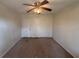 Bedroom with ceiling fan and carpet flooring; a blank canvas for new decor at 5080 Springtree Ct, Lithonia, GA 30038