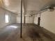 Large two-car garage with concrete floor, ready for parking or hobbies at 5080 Springtree Ct, Lithonia, GA 30038