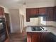 Kitchen with granite counter tops, electric stove, and custom cabinets at 5080 Springtree Ct, Lithonia, GA 30038