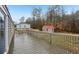 Wooden back deck overlooks large private lot with storage shed at 428 Rainey Rd, Temple, GA 30179