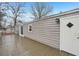 Wooden back deck wraps around the side of the home at 428 Rainey Rd, Temple, GA 30179