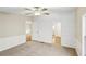 Bedroom featuring neutral carpet, white walls, ceiling fan, and bright natural light at 428 Rainey Rd, Temple, GA 30179