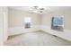 Bedroom with neutral carpet, white walls, and two windows that provide natural light at 428 Rainey Rd, Temple, GA 30179