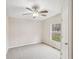 This spacious bedroom features neutral paint, carpet and a ceiling fan at 428 Rainey Rd, Temple, GA 30179