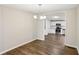 Open dining area with stylish lighting, seamlessly connecting to the modern kitchen at 428 Rainey Rd, Temple, GA 30179