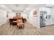 Bright bedroom with light wood floors and a stainless steel refrigerator at 4450 Sandalwood Way, Cumming, GA 30041