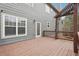 Lovely wooden deck with stairs, a pergola, a door, and a window overlooking backyard at 4450 Sandalwood Way, Cumming, GA 30041