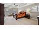 Serene main bedroom features tray ceiling, natural light, and sitting area at 4450 Sandalwood Way, Cumming, GA 30041