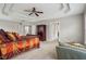 Spacious main bedroom showcasing neutral colors, tray ceiling and ceiling fan at 4450 Sandalwood Way, Cumming, GA 30041