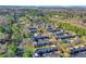 Aerial view of the townhome community surrounded by lush trees and landscaping at 11 Newport Nw Pl, Atlanta, GA 30318