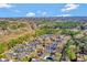 Aerial view of the townhome community, surrounded by lush greenery with the city skyline in the distance at 11 Newport Nw Pl, Atlanta, GA 30318