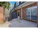 A fenced backyard, brick wall and a door at 11 Newport Nw Pl, Atlanta, GA 30318