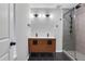 Modern bathroom with a double vanity and a sleek glass-enclosed shower at 11 Newport Nw Pl, Atlanta, GA 30318