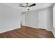 Large bedroom with ceiling fan and wood-look vinyl floors at 11 Newport Nw Pl, Atlanta, GA 30318