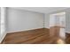 Living room with wood flooring, neutral paint and white trim at 11 Newport Nw Pl, Atlanta, GA 30318