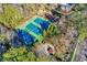 Aerial view of the community tennis courts and playground, surrounded by mature trees at 11 Newport Nw Pl, Atlanta, GA 30318