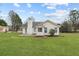 Spacious backyard featuring a patio, chimney and a well-maintained lawn at 110 Oak Wood Ln, Covington, GA 30016