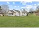 Wide backyard view of a cozy patio and covered porch at 110 Oak Wood Ln, Covington, GA 30016