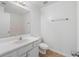 Bathroom vanity featuring a mirror, a sink and a toilet at 110 Oak Wood Ln, Covington, GA 30016