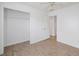 Bedroom with an empty closet, a large window and wood-look floors at 110 Oak Wood Ln, Covington, GA 30016