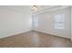 Bright bedroom with wood-look flooring, tray ceiling and plenty of natural light at 110 Oak Wood Ln, Covington, GA 30016