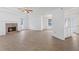 Cozy living room featuring a fireplace, wood-look flooring, and an open floor plan at 110 Oak Wood Ln, Covington, GA 30016