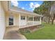 Covered front porch with a view of the lawn at 110 Oak Wood Ln, Covington, GA 30016