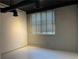 Bedroom features a large window and ample natural light, spacious and inviting at 172 Haynes Sw St # 102, Atlanta, GA 30313