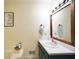 Bathroom featuring a soaking tub and a vanity with a framed mirror at 2096 Old Jackson Rd, Locust Grove, GA 30248