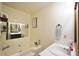 Well-lit bathroom with a soaking tub, vanity, and decorative accents at 2096 Old Jackson Rd, Locust Grove, GA 30248