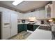 Well-lit kitchen featuring stainless steel appliances, white cabinets, and stylish countertops at 2096 Old Jackson Rd, Locust Grove, GA 30248