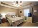 Primary bedroom featuring a tray ceiling, rustic wooden bed frame, and coordinated furniture at 2096 Old Jackson Rd, Locust Grove, GA 30248