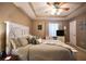 Primary bedroom featuring a tray ceiling, rustic wooden bed frame, and coordinated furniture at 2096 Old Jackson Rd, Locust Grove, GA 30248