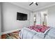 Bright bedroom featuring hardwood floors and a mounted flat screen television at 2300 Peachford Rd # 1410, Atlanta, GA 30338