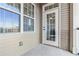 Cozy patio with neutral siding and a door leading to the interior at 2300 Peachford Rd # 1410, Atlanta, GA 30338