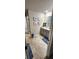 Stylish bathroom with double vanity, granite countertops, and beach-themed decor at 11700 Brightside Pkwy, Hampton, GA 30228