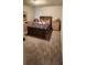 Cozy bedroom featuring carpeted floors, a queen size bed, and ample natural light at 11700 Brightside Pkwy, Hampton, GA 30228