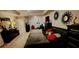 Spacious primary bedroom featuring elegant décor, a tray ceiling, and plush carpet at 11700 Brightside Pkwy, Hampton, GA 30228