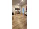 Bright dining area with sleek hardwood flooring and modern decor at 11700 Brightside Pkwy, Hampton, GA 30228