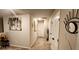 Hallway features neutral colors and wall decor at 11700 Brightside Pkwy, Hampton, GA 30228