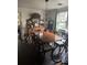 Traditional dining room showcasing a large wooden table and antique buffet, needing TLC at 502 Turner Ave, Palmetto, GA 30268