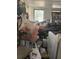 Small room filled with storage items, including bins, bags, and a washing machine at 502 Turner Ave, Palmetto, GA 30268