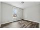 Basement featuring neutral walls, new gray floors and a bright window at 5368 Stafford Nw Dr, Lilburn, GA 30047
