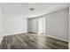 Basement features neutral walls, new gray floors and a door way at 5368 Stafford Nw Dr, Lilburn, GA 30047