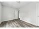 Basement features neutral walls, new gray floors and a door way at 5368 Stafford Nw Dr, Lilburn, GA 30047