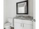 Bathroom features a granite countertop vanity with a black framed mirror at 5368 Stafford Nw Dr, Lilburn, GA 30047