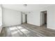 Well-lit bedroom featuring new floors and two closets at 5368 Stafford Nw Dr, Lilburn, GA 30047